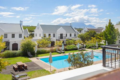 an aerial view of a house with a swimming pool at Winelands Golf Lodges 11 in Stellenbosch