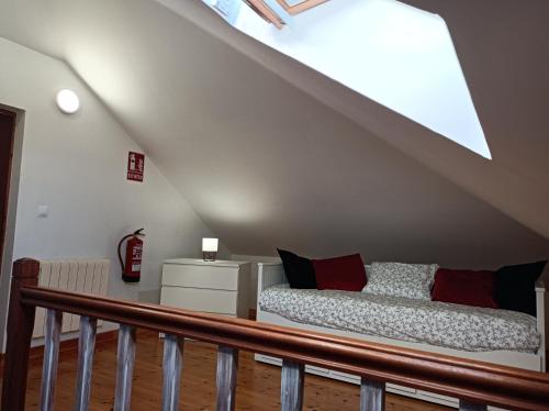 a bedroom with a bed in the attic at Fantástico apartamento en las playas de Suances in Suances