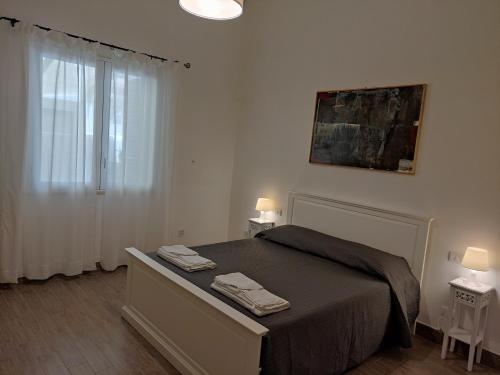 A bed or beds in a room at Villa Punta Piccola sul mare