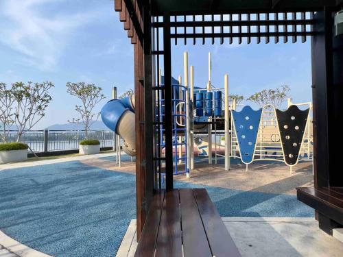 a park with a playground with a slide at IMPERIUM RESIDENCE KUANTAN [Seaview] Family Suite in Kuantan