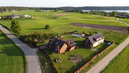 an aerial view of a house on a green field at Zakątek Mikołajewo 14 in Mikolajewo