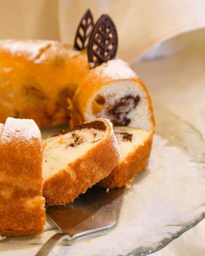 a cake with a blueberry filling on a plate at Hotel Polo in Rimini