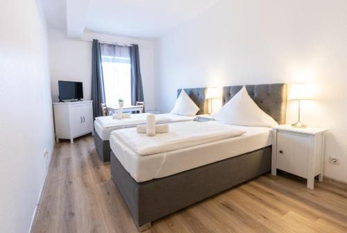 Cama o camas de una habitación en Hotel Bergheim