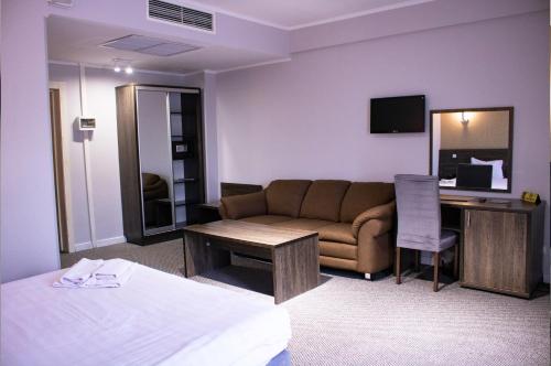 Voodi või voodid majutusasutuse Golden Palace Hotel toas
