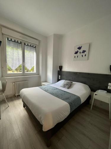 Postel nebo postele na pokoji v ubytování Hôtel Agena