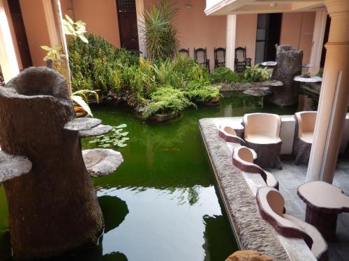 a koi pond in the lobby of a hotel at Villa Ranmenika in Ahungalla