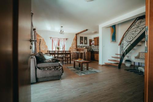 a living room with a couch and a table at Green Garden Plitvice lakes in Plitvica selo