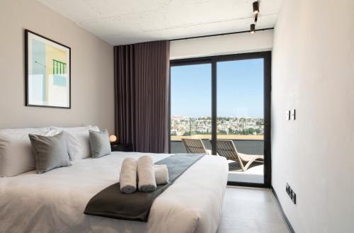 Postel nebo postele na pokoji v ubytování Aparthotel Adagio Malta Central