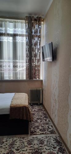 TV a/nebo společenská místnost v ubytování Hotel SUGD & Guest House