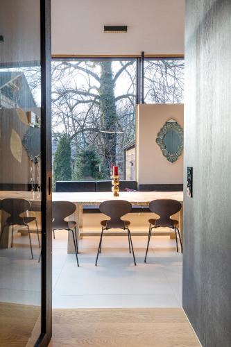 a dining room with a table and chairs at Villa Unterswand - Self Check-in in Grünau im Almtal