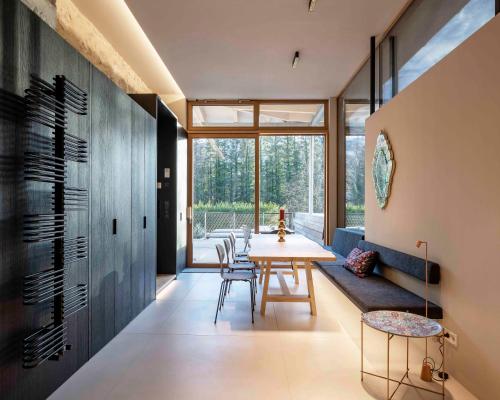 a dining room with a table and chairs at Villa Unterswand - Self Check-in in Grünau im Almtal