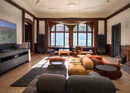 a living room with a couch and a tv at Villa Unterswand - Self Check-in in Grünau im Almtal