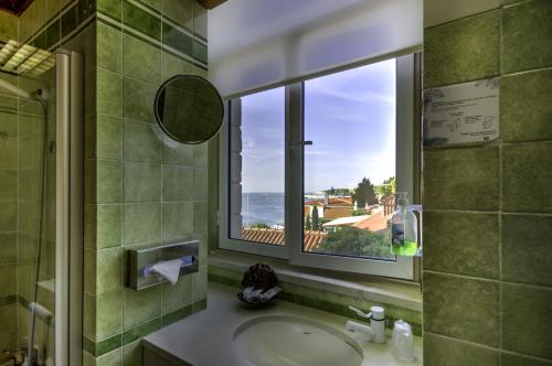 Ванная комната в Hotel Solar Palmeiras