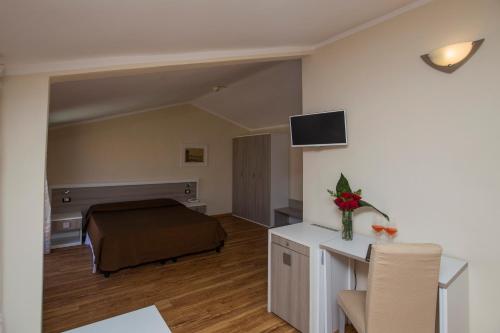 TV a/nebo společenská místnost v ubytování Hotel Fabricia