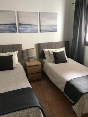 A bed or beds in a room at Casa Dylan