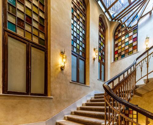 a staircase in a building with stained glass windows at Cronton Design Hotel in Istanbul