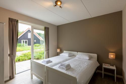 Postel nebo postele na pokoji v ubytování Villapark Ehzerburg