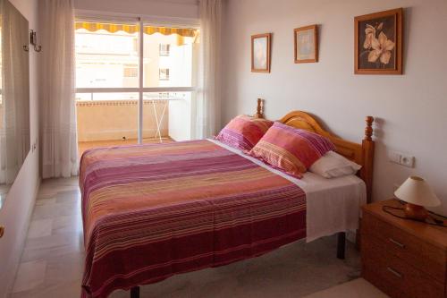 Rúm í herbergi á Apartamento Plumeria