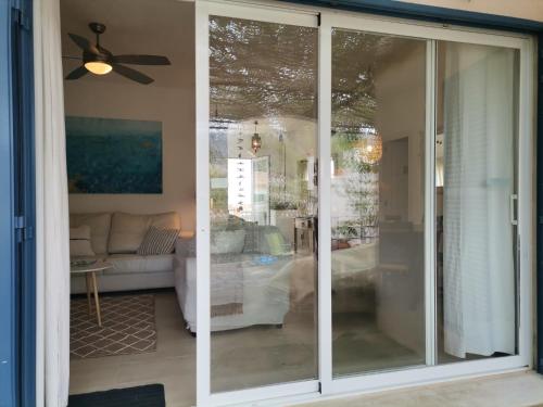 a sliding glass door in a living room at En lugar tranquilo alejado de zonas turisticas in Banyalbufar