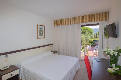 Postel nebo postele na pokoji v ubytování Hotel Fabricia