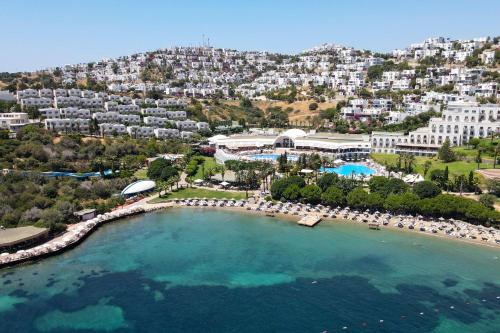 an aerial view of a resort with a pool at Yasmin Bodrum Resort in Gümüşlük