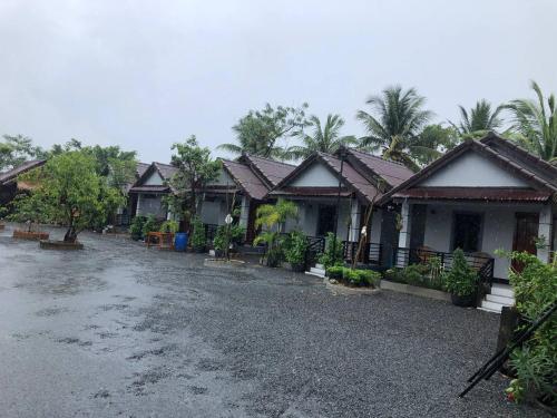 a row of houses with at Treuy Koh Bungalow in Kampot