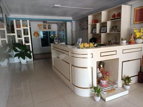 a kitchen with an island with a fireplace in it at Green Garden Guesthouse in Kampot