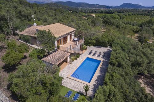 an aerial view of a house with a swimming pool at Es Puchet in Búger