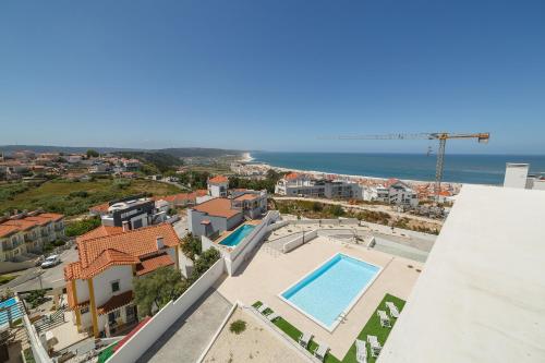 a view of the city and the ocean from a building at Nazaré Views X - By SCH in Nazaré