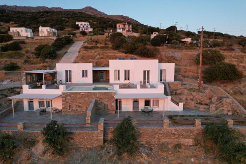 an aerial view of a house on a hill at Captain's Pounda Suite in Apróvaton