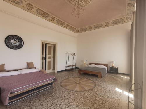 A bed or beds in a room at Villa San Giorgio Guest House