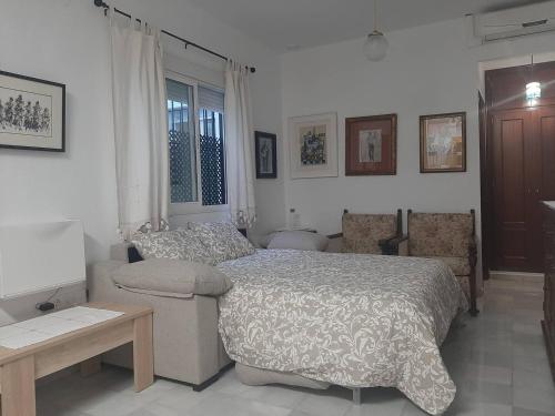Postel nebo postele na pokoji v ubytování Barrio Santa Cruz VUT-SE-00227