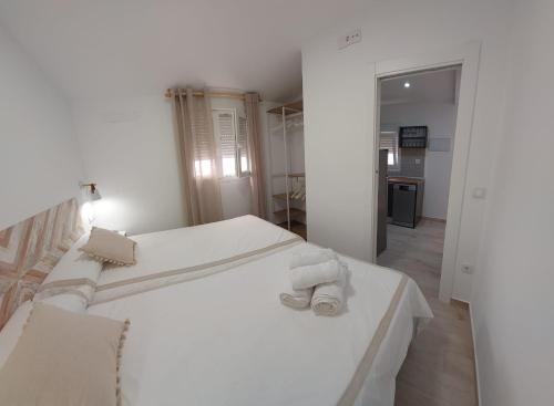 Postel nebo postele na pokoji v ubytování Apartamentos Centro Confor 3