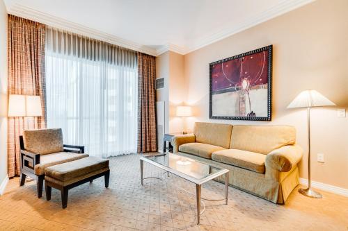 a living room with a couch and a table at Jet Luxury Elite at The Signature in Las Vegas