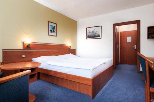 Postel nebo postele na pokoji v ubytování Resort Dlouhé Stráně