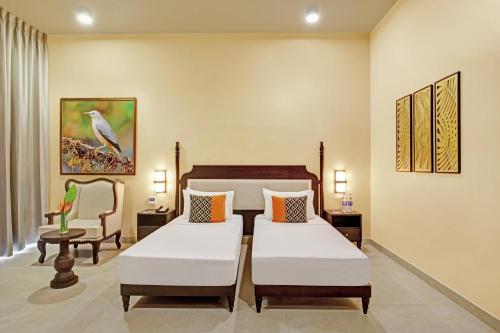 Un pat sau paturi într-o cameră la Aurika, Coorg - Luxury by Lemon Tree Hotels