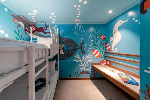 Ένα ή περισσότερα κρεβάτια σε δωμάτιο στο PrideInn Paradise Beach Resort & Spa Mombasa
