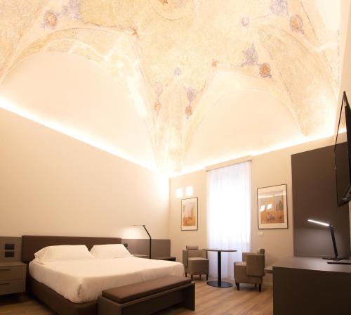 Postel nebo postele na pokoji v ubytování Hotel Orientale