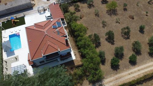 an overhead view of a house with a red roof at Villa Heaven in Donji Zemunik