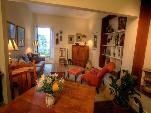 a living room with a couch and a table at Geneva On The Lake Boutique Resort Hotel in Geneva