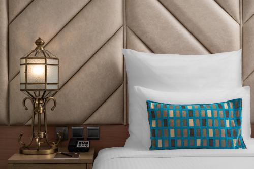 Una cama o camas en una habitación de Elaf Al Taqwa Hotel