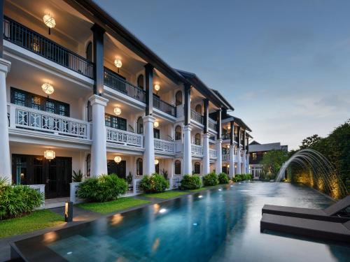 a view of the courtyard of a building with a swimming pool at Siri Village Chiang Mai in Chiang Mai