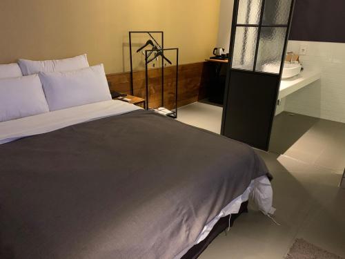 Postel nebo postele na pokoji v ubytování Hotel Gaden