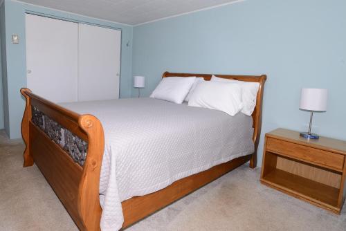 a bedroom with a large bed and a window at Island View Motel in Old Orchard Beach