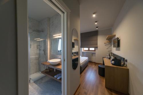 a bathroom with a shower and a sink and a tub at Villa Pietra Bianca - Luxury stay in Puglia in Trani