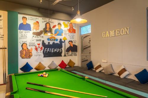 a billiard room with a green pool table at Whoopers Hostel Bir in Bīr