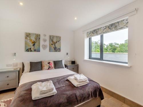 Postel nebo postele na pokoji v ubytování Secret Kingdom Cottage