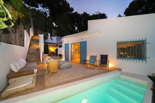 a backyard with a swimming pool and a house at SON DE MAR - Managed by Almarina in Jávea