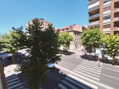 an aerial view of a city street with trees at Hostal Carmen by gaiarooms in Salamanca