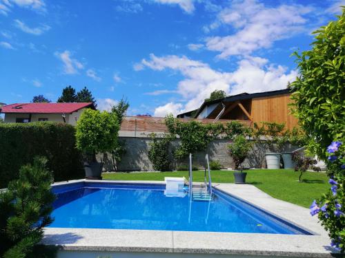 a swimming pool in the backyard of a house at Haus Thomas in Telfs